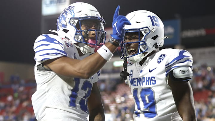Dec 17, 2024; Frisco, TX, USA; Memphis Tigers wide receiver Roc Taylor (3) and wide receiver Jamari Hawkins (19) celebrate a touchdown in the second quarter against the West Virginia Mountaineers at Toyota Stadium. Mandatory Credit: Tim Heitman-Imagn Images Dec 17, 2024; Frisco, TX, USA; Memphis Tigers wide receiver Roc Taylor (3) and wide receiver Jamari Hawkins (19) celebrate a touchdown in the second quarter against the West Virginia Mountaineers at Toyota Stadium. Mandatory Credit: Tim Heitman-Imagn Images