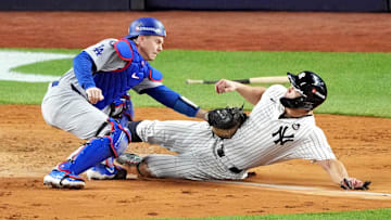 Oct 28, 2024; New York, New York, USA; Los Angeles Dodgers catcher Will Smith (16) tags out New York Yankees designated hitter Giancarlo Stanton (27) at home plate during the fourth inning in game three of the 2024 MLB World Series at Yankee Stadium. Mandatory Credit: Robert Deutsch-Imagn Images