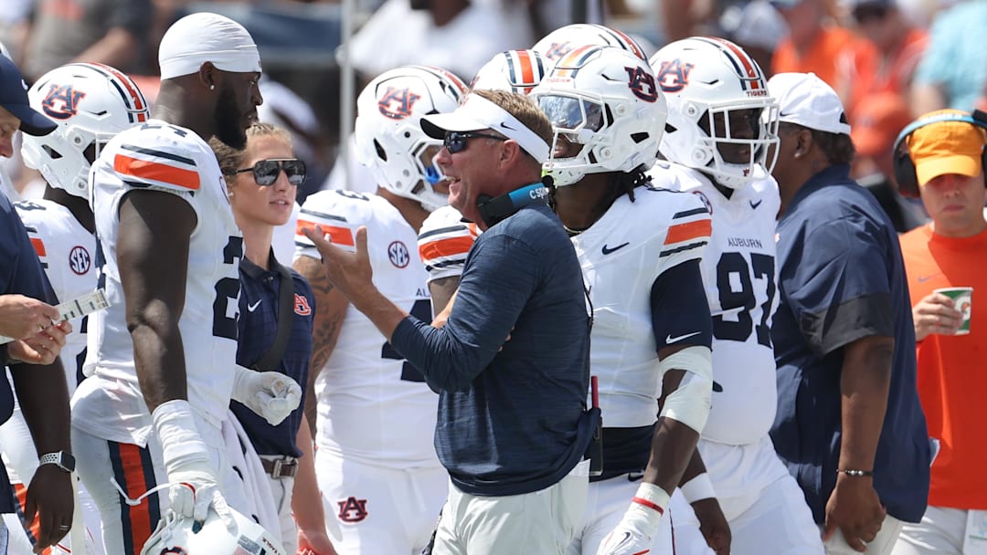 Sep 13, 2025; Auburn, Alabama, USA; Auburn Tigers head coach Hugh Freeze talks with defensive end Keyron Crawford (24) during the second quarter against the South Alabama Jaguars at Jordan-Hare Stadium. Mandatory Credit: John Reed-Imagn Images