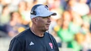 Oct 11, 2025; South Bend, Indiana, USA; NC State Wolfpack head coach Dave Doeren walks on the field against the Notre Dame Fighting Irish during the second half at Notre Dame Stadium. Mandatory Credit: Michael Caterina-Imagn Images