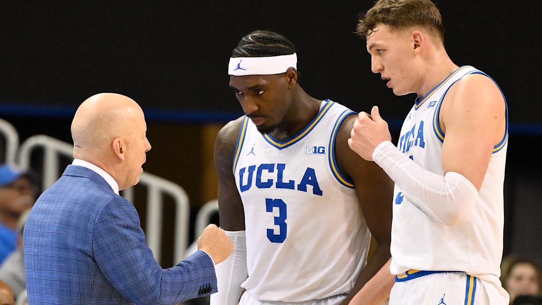 Feb 21, 2026; Los Angeles, California, USA; UCLA Bruins head coach Mick Cronin with guard Eric Dailey Jr. (3) and UCLA forward Tyler Bilodeau (34) during the second half at Pauley Pavilion presented by Wescom Financial. Mandatory Credit: Robert Hanashiro-Imagn Images