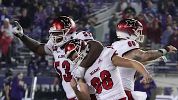 Sep 24, 2022; Evanston, Illinois, USA; Miami (Ohio) Redhawks place kicker Graham Nicholson (98) celebrates the game winning field goal with offensive lineman Caleb Shaffer (53) against the Northwestern Wildcats during the second half at Ryan Field. Mandatory Credit: David Banks-Imagn Images