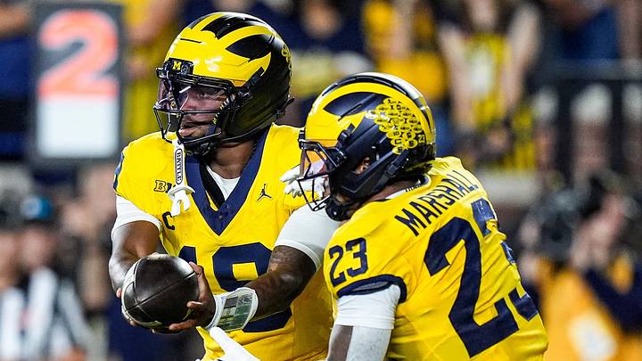 Michigan quarterback Bryce Underwood (19) hands the ball to running back Jordan Marshall (23) against Western Michigan during the first half at Michigan Stadium in Ann Arbor on Saturday, Sept. 5, 2026.