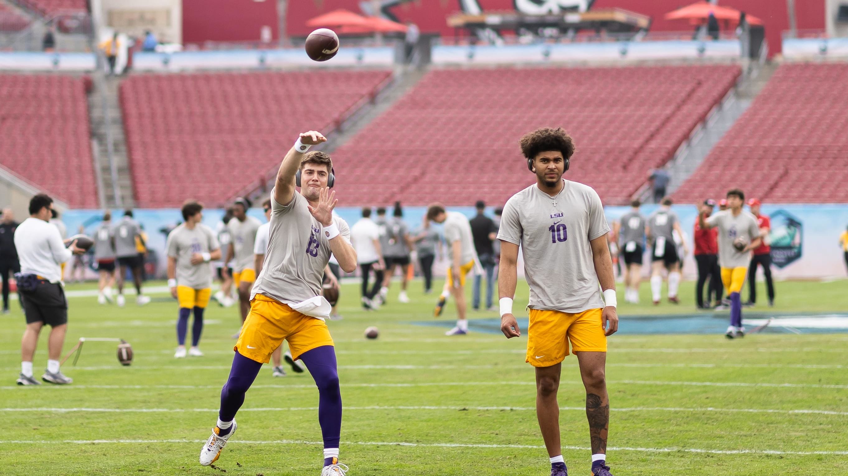 Jan 1, 2024; Tampa, FL, USA; LSU Tigers quarterbacks Garrett Nussmeier (13) and Rickie Collins (10)