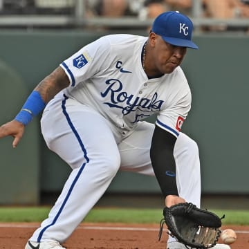 Jul 27, 2024; Kansas City, Missouri, USA; Kansas City Royals first baseman Salvador Perez (13) fields a ground ball in the first inning against the Chicago Cubs at Kauffman Stadium.