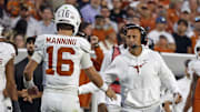 Texas Longhorns head coach Steve Sarkisian reacts with Texas Longhorns quarterback Arch Manning  during the fourth quarter against the Mississippi State Bulldogs at Davis Wade Stadium at Scott Field.