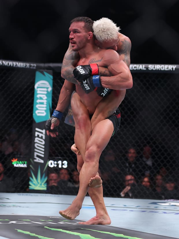 Charles Oliveira (red gloves) fights Michael Chandler (blue gloves) in the lightweight bout during UFC 309 at Madison Square 