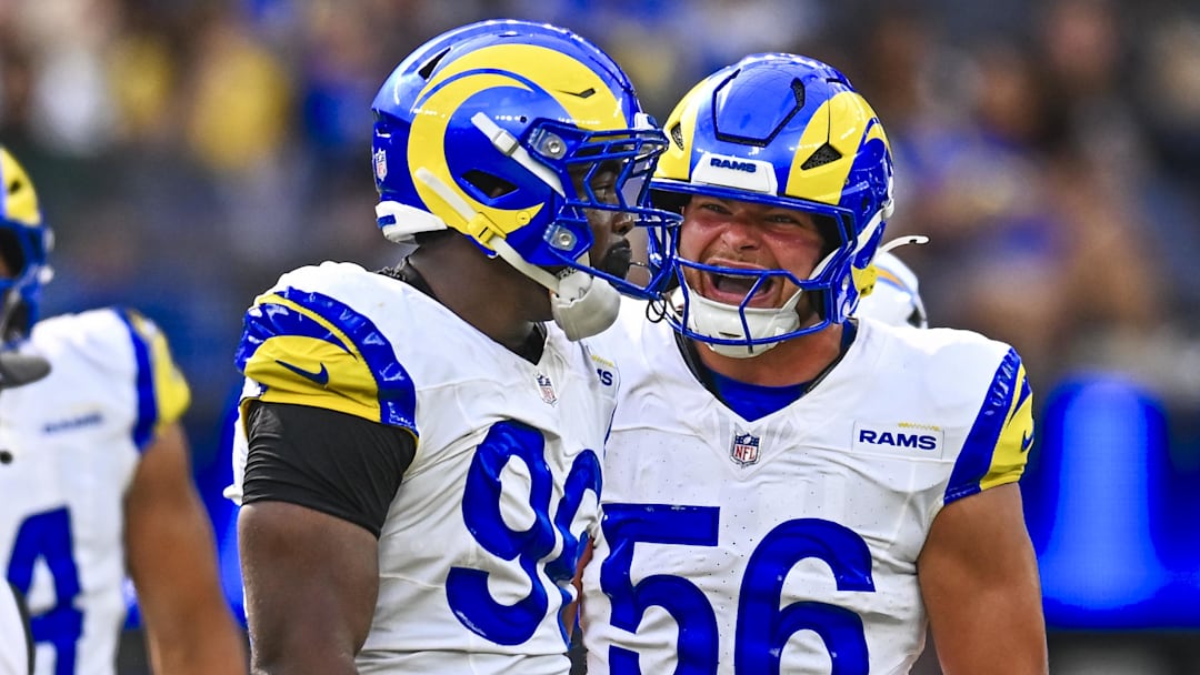Aug 16, 2025; Inglewood, California, USA; Los Angeles Rams linebacker Keir Thomas (96) and linebacker Shaun Dolac (56) react after a successful block against the Los Angeles Chargers during the first quarter at SoFi Stadium. Mandatory Credit: Jonathan Hui-Imagn Images