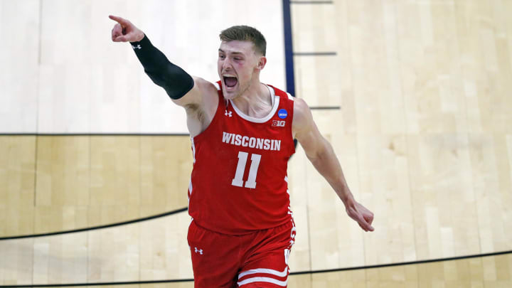 Wisconsin Badgers forward Micah Potter (11) celebrates a shot during the first round of the 2021 NCAA Tournament on Friday, March 19, 2021, at Mackey Arena in West Lafayette, Ind. Mandatory Credit: Robert Scheer/IndyStar via USA TODAY Sports