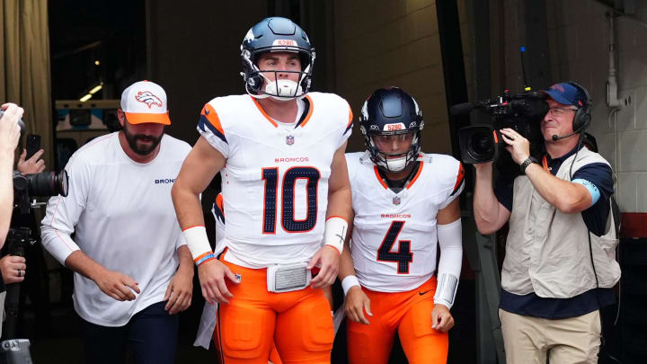 Aug 18, 2024; Denver, Colorado, USA; Denver Broncos quarterback Bo Nix (10) and quarterback Zach Wilson (4) before the preseason game against the Green Bay Packers at Empower Field at Mile High. 