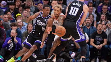 Feb 22, 2024; Sacramento, California, USA; Sacramento Kings guard De'Aaron Fox (5) dribbles around the pick set by forward Domantas Sabonis (10) during the fourth quarter at Golden 1 Center. Mandatory Credit: Ed Szczepanski-USA TODAY Sports