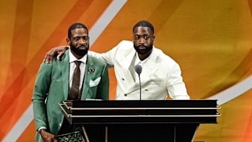 Aug 12, 2023; Springfield, MA, USA;  Dwyane Wade (right) calls his father Dwyane Wade Sr. (left) onto the stage at his induction into the 2023 Basketball Hall of Fame at Symphony Hall. Mandatory Credit: Eric Canha-Imagn Images