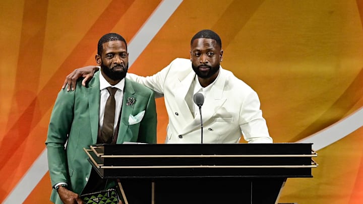 Aug 12, 2023; Springfield, MA, USA; Dwyane Wade (right) calls his father Dwyane Wade Sr. (left) onto the stage at his induction into the 2023 Basketball Hall of Fame at Symphony Hall. Mandatory Credit: Eric Canha-Imagn Images Aug 12, 2023; Springfield, MA, USA; Dwyane Wade (right) calls his father Dwyane Wade Sr. (left) onto the stage at his induction into the 2023 Basketball Hall of Fame at Symphony Hall. Mandatory Credit: Eric Canha-Imagn Images