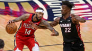 Mar 4, 2021; New Orleans, Louisiana, USA; New Orleans Pelicans forward Brandon Ingram (14) is defended by Miami Heat forward Jimmy Butler (22).