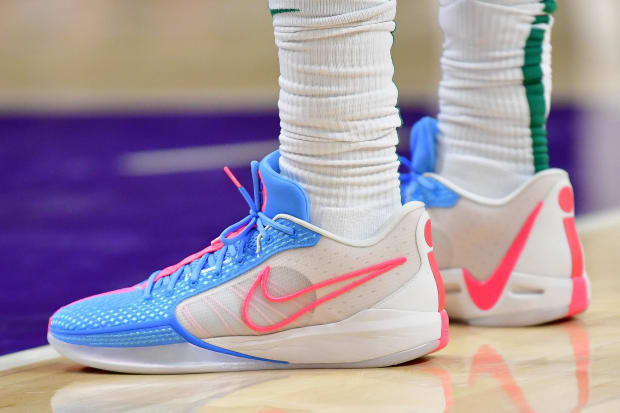 Sabrina Ionescu's white and blue Nike sneakers.