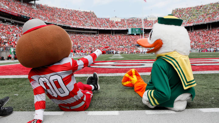 Brutus Buckeye and the Oregon Ducks mascot watch from the sideline during the first half of the NCAA