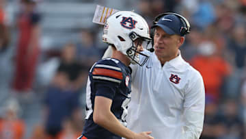 Nov 22, 2025; Auburn, Alabama, USA;  Auburn Tigers interim head coach DJ Durkin congratulates kicker Alex McPherson (38) after making a field goal against the Mercer Bears during the fourth quarter at Jordan-Hare Stadium. Mandatory Credit: John Reed-Imagn Images