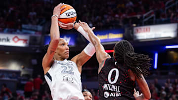 A’ja Wilson (left) had 13 points on 6-of-20 shooting in Game 3, well below her average. But her defense and her teammates stepping up secured the Aces’ win. 