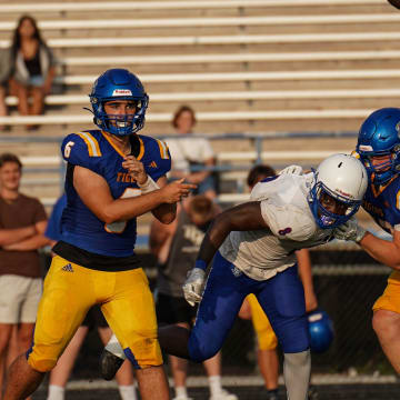 Martin County quarterback Vaughn O'Brien completes a pass against Pahokee in a high school spring football game Thursday, May 16, 2024 at Martin County High School.