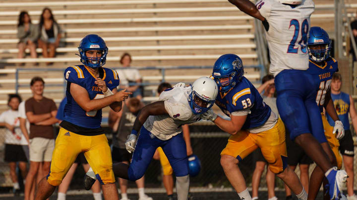 Martin County quarterback Vaughn O'Brien completes a pass against Pahokee in a high school spring football game Thursday, May 16, 2024 at Martin County High School.