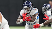 Aug 15, 2025; Atlanta, Georgia, USA; Tennessee Titans running back Kalel Mullings (28) runs against the Atlanta Falcons during the first half at Mercedes-Benz Stadium. Mandatory Credit: Dale Zanine-Imagn Images