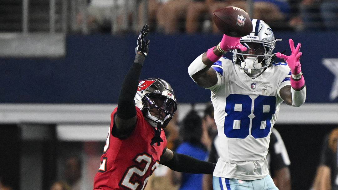 Dallas Cowboys wide receiver CeeDee Lamb (88) makes a catch over Tampa Bay Buccaneers cornerback Zyon McCollum (27) at AT&T Stadium.