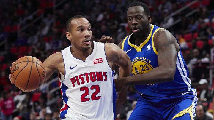 Dec 8, 2017; Detroit, MI, USA; Detroit Pistons guard Avery Bradley (22) dribbles defended by Golden State Warriors forward Draymond Green (23) in the second half at Little Caesars Arena. Mandatory Credit: Rick Osentoski-USA TODAY Sports