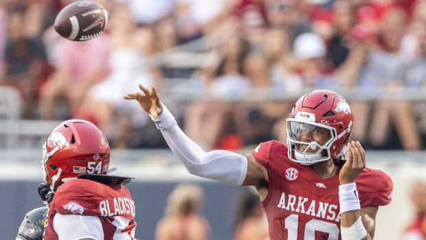 Razorbacks quarterback Taylen Green throws a pass against UAPB