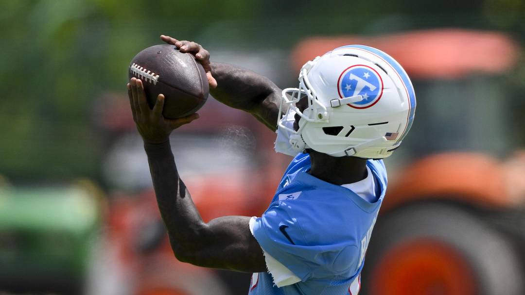 Jun 16, 2026; Nashville, TN, USA;  Tennessee Titans wide receiver Wan'Dale Robinson (4) makes a catch during day 1 of mini-camp at Vanderbilt Health Football Center. Mandatory Credit: Steve Roberts-Imagn Images