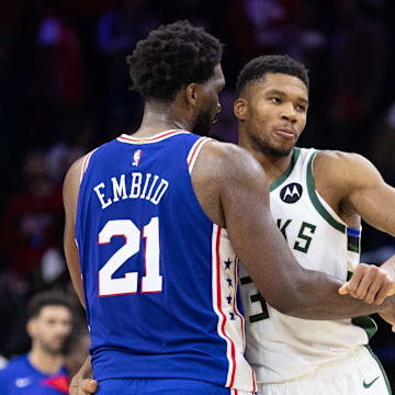 Oct 20, 2022; Philadelphia, Pennsylvania, USA; Philadelphia 76ers center Joel Embiid (21) and Milwaukee Bucks forward Giannis Antetokounmpo (34) embrace after the game at Wells Fargo Center. Mandatory Credit: Bill Streicher-Imagn Images