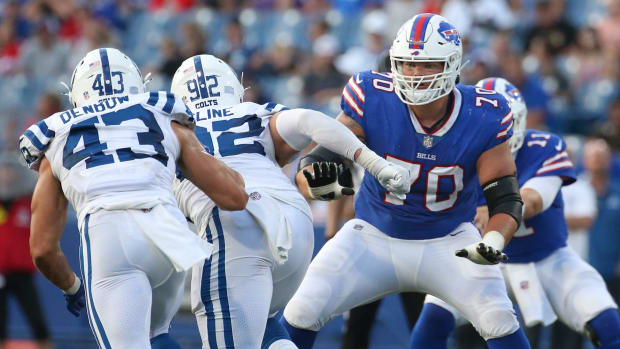 Buffalo tackle Alec Anderson (70) looks to pick up a block at the line during the Bills  27-24 win