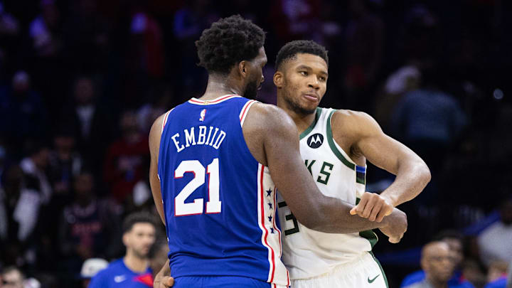 Oct 20, 2022; Philadelphia, Pennsylvania, USA; Philadelphia 76ers center Joel Embiid (21) and Milwaukee Bucks forward Giannis Antetokounmpo (34) embrace after the game at Wells Fargo Center. Mandatory Credit: Bill Streicher-Imagn Images