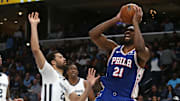 Apr 6, 2024; Memphis, Tennessee, USA; Philadelphia 76ers center Joel Embiid (21) shoots as Memphis Grizzlies forward Maozinha Pereira (25) defends during the first half at FedExForum. Mandatory Credit: Petre Thomas-Imagn Images
