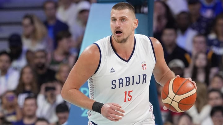 Serbia power forward Nikola Jokic (15) dribbles in the fourth quarter against the United States during the Paris 2024 Olympic Summer Games at Stade Pierre-Mauroy. Mandatory Credit: 