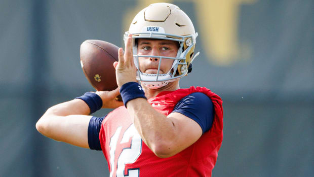 Freshman quarterback CJ Carr throws a pass during Notre Dame's opening practice of the 2024 football season.