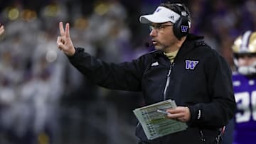 Nov 2, 2024; Seattle, Washington, USA; Washington Huskies head coach Jedd Fisch signals for a two-point conversion try against the USC Trojans following a touchdown during the fourth quarter at Alaska Airlines Field at Husky Stadium. Mandatory Credit: Joe Nicholson-Imagn Images