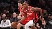 Feb 4, 2025; Brooklyn, New York, USA; Houston Rockets forward Amen Thompson (1) dribbles up court during the first half against the Brooklyn Nets at Barclays Center. Mandatory Credit: Vincent Carchietta-Imagn Images
