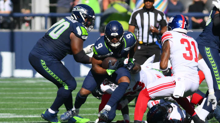 Oct 6, 2024; Seattle, Washington, USA; Seattle Seahawks running back Kenneth Walker III (9) carries the ball against the New York Giants during the first half at Lumen Field. Mandatory Credit: Steven Bisig-Imagn Images