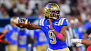 Aug 30, 2025; Pasadena, California, USA;  UCLA Bruins quarterback Nico Iamaleava (9) throws against the against the Utah Utes during the first half at the Rose Bowl. Mandatory Credit: Gary A. Vasquez-Imagn Images