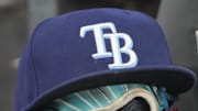 Sep 26, 2025; Toronto, Ontario, CAN; The hat and glove of Tampa Bay Rays third baseman Junior Caminero (13) in the dugout during the game against the Toronto Blue Jays at Rogers Centre. 