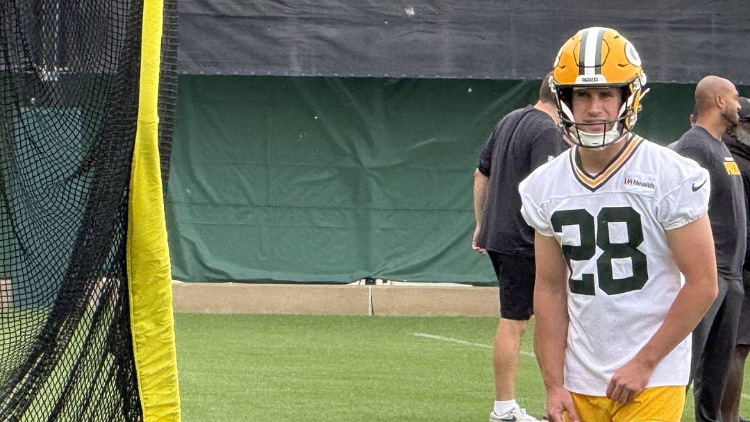 Packers kicker Trey Smack gets ready to kick the ball into the practice net.