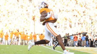 Tennessee running back Jaylen Wright (0) runs for a touchdown in the opening minutes of the game