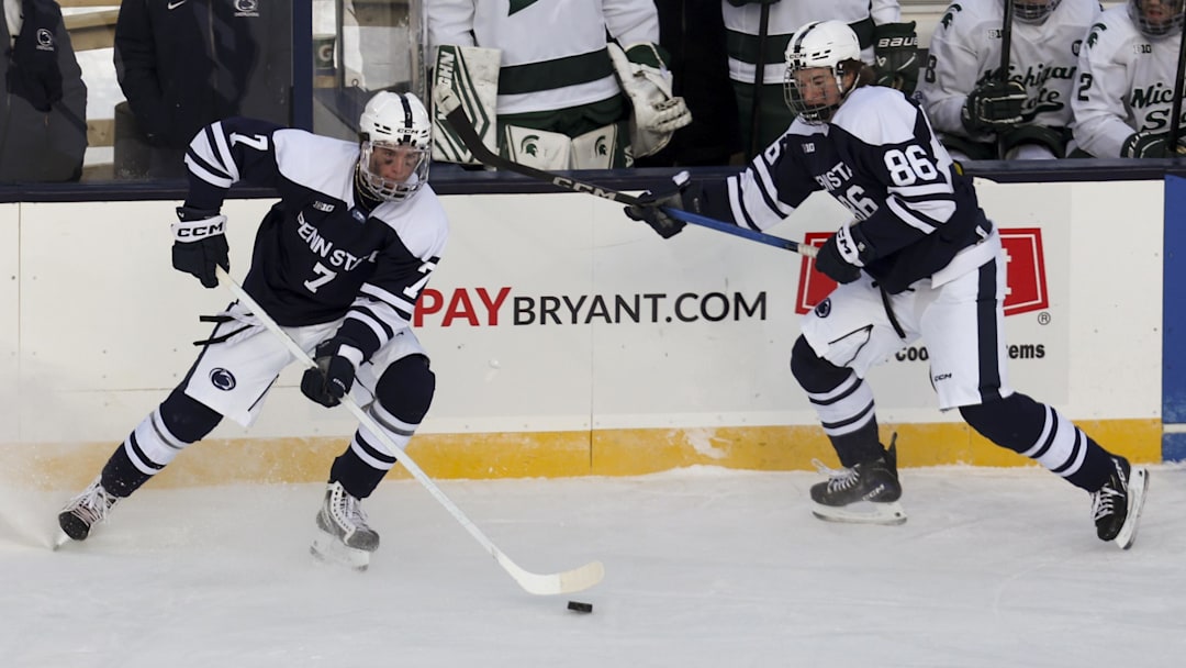 Jan 31, 2026; State College, PA, USA; Penn State Nittany Lions defenseman Jackson Smith (7) passes the puck during the third period against the Michigan State Spartans at Beaver Stadium. Mandatory Credit: Matthew O'Haren-Imagn Images