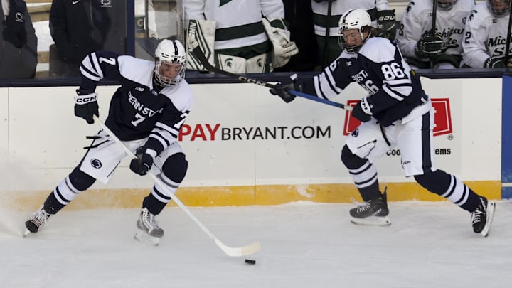 Jan 31, 2026; State College, PA, USA; Penn State Nittany Lions defenseman Jackson Smith (7) passes the puck during the third period against the Michigan State Spartans at Beaver Stadium. Mandatory Credit: Matthew O'Haren-Imagn Images