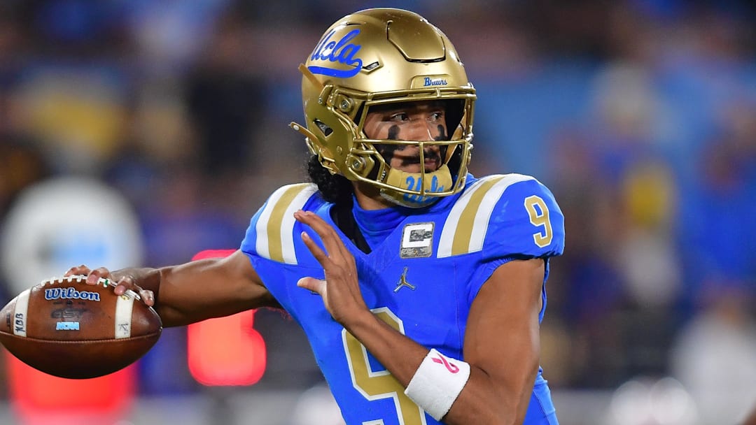Nov 8, 2025; Pasadena, California, USA; UCLA Bruins quarterback Nico Iamaleava (9) throws against the Nebraska Cornhuskers during the first half at the Rose Bowl. Mandatory Credit: Gary A. Vasquez-Imagn Images