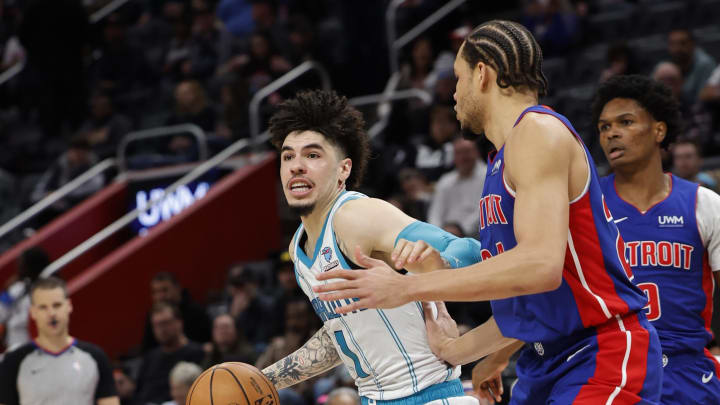 Jan 24, 2024; Detroit, Michigan, USA;  Charlotte Hornets guard LaMelo Ball (1) dribbles defended by Detroit Pistons forward Kevin Knox II (24) in the second half at Little Caesars Arena. Mandatory Credit: Rick Osentoski-USA TODAY Sports