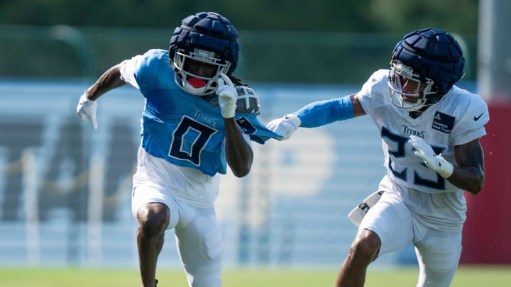 Tennessee Titans wide receiver Calvin Ridley (0) is defended by cornerback Tre Avery (23) during the Tennessee Titans training camp at Ascension Saint Thomas Sports Park in Nashville, Tenn., Tuesday, July 30, 2024.