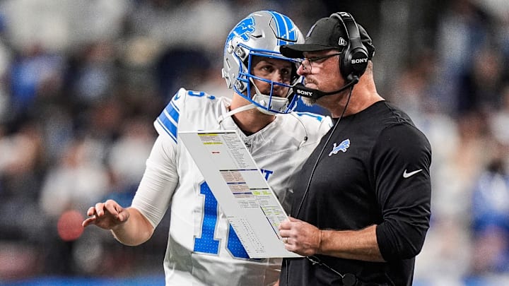 Detroit Lions quarterback Jared Goff (16) talks to head coach Dan Campbell before a play against Dallas Cowboys during the second half at Ford Field in Detroit on Thursday, Dec. 4, 2025.