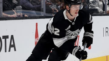 Oct 24, 2024; Los Angeles, California, USA; Los Angeles Kings defenseman Brandt Clarke (92) skates with the puck during the first period against the San Jose Sharks at Crypto.com Arena. Mandatory Credit: Jason Parkhurst-Imagn Images