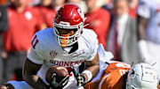 Oklahoma Sooners wide receiver Javonnie Gibson (11) runs with the ball during the game between the Texas Longhorns and the Oklahoma Sooners at the Cotton Bowl in October.